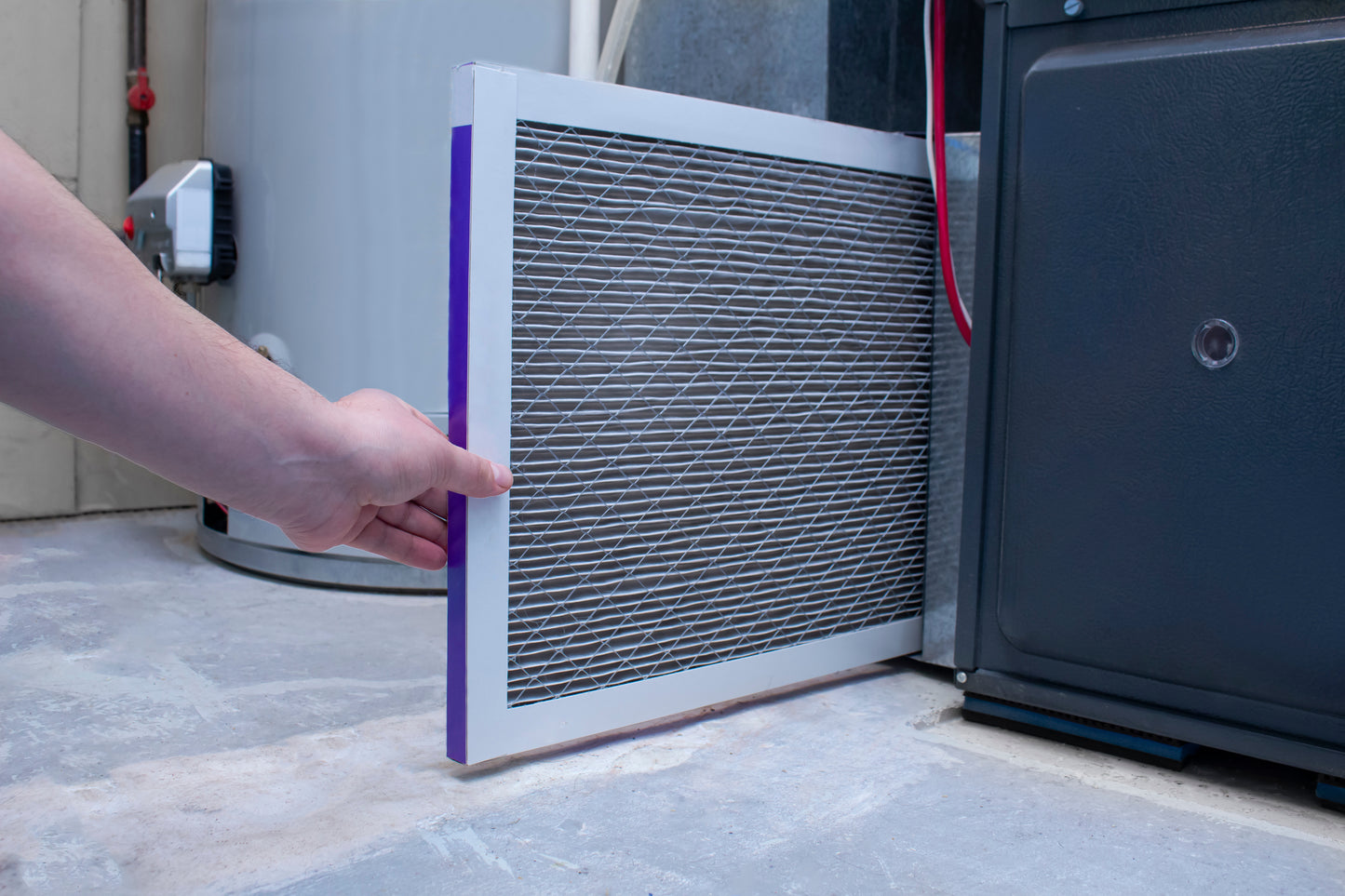 Changing the air filter on a home furnace